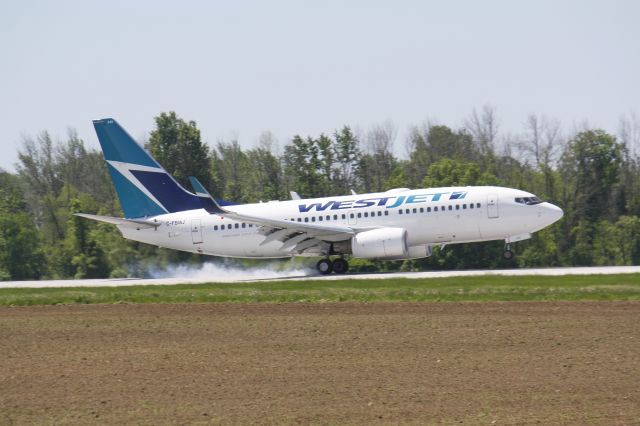 Boeing 737-700 (C-FBWJ) - Afternoon Arrival from Winnipeg,Landing CYXU,London..June 5,2014