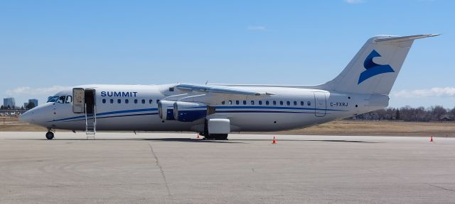 Avro RJ-100 Avroliner (C-FXRJ) - Summit Air BAE-146 RJ100 C-FXRJ at YWG after arrival from YEG on 1 May 23.  br /br /Aircraft was delivered in 1997 and spent the first twenty years of its life flying out of the United Kingdom.  The aircraft arrived in Canada in 2017 as now flies with Summit Air of Yellowknife, Northwest Territories.