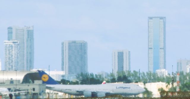BOEING 747-8 (D-ABYM) - A Lufthansa B747-8i Reg#D-ABYM"Being pushed-back and turned around."For the departure to Frankfurt am Main (FRA/EDDF) From a distance!!