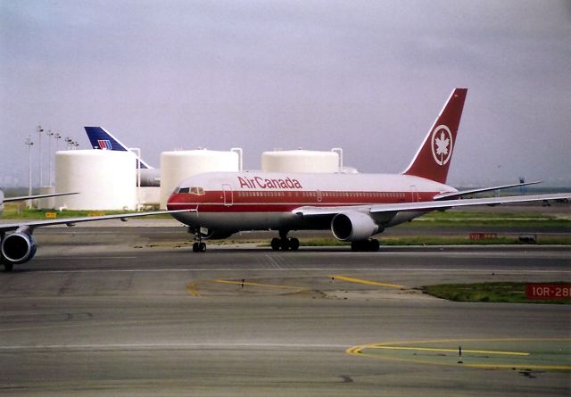 BOEING 767-200 — - KSFO - cant make the reg out - this 767 200 landing from Montreal on runway 28R at SFO.