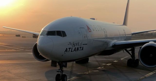 Boeing 777-200 (N702DN) - Sunset gate arrival at LAX Terminal 2.  Delta Ship 7102. (Photo grab from video)