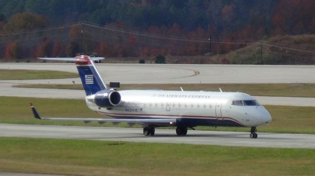 Canadair Regional Jet CRJ-200 (N429AW) - American (Air Wisconsin) 4522 departing to New York LGA at 1:01 PM CST.  Taken November 29, 2015 with Sony HDR-CX230.  