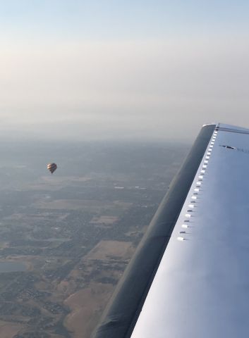 Piper Malibu Mirage (N4NY) - Being vectored around hot air balloons departing KBJC over DEN.