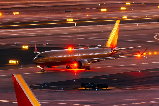 Boeing 737 MAX 8 (N871HK) - Southwest Airlines 737 Max 8 in Canyon Gold retro livery taxiing at PHX on 11/30/22. Taken with a Canon 850D and Tamron 70-200 G2 lens.