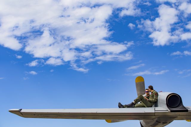 Lockheed P-3 Orion (3297) - Pilots on a Norwegian P3-N Orion relaxing in the sun on the left wing ;-)