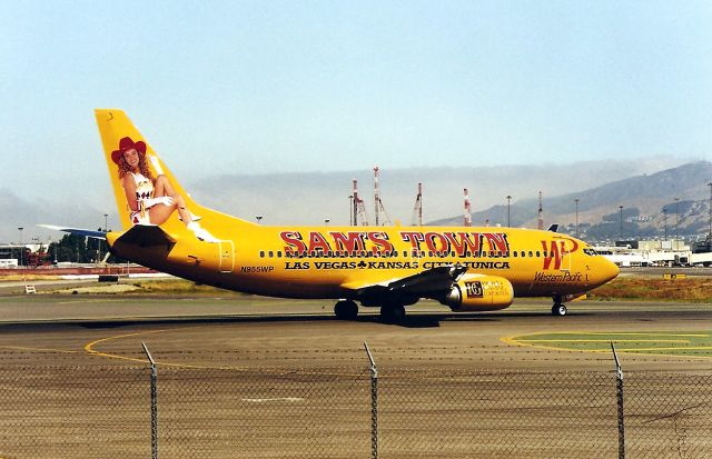 BOEING 737-300 (N955WP) - KSFO - Western Pacific logo jet Sams Town  set to depart runway 1 R at SFO for Colorado Springs. Note the construction cranes in the background as the new SFO terminal is under construction. This photo probable 1998 as the new Intl terminal opened in Dec 2000.