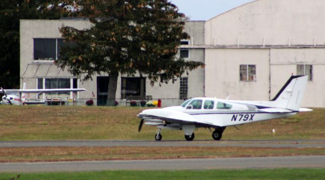 Beechcraft 56 Turbo Baron (N79X) - Shown on the active runway is this 1967 Beechcraft 56 Turbo Baron in the Autumn of 2021.