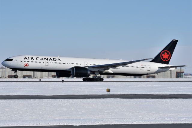 BOEING 777-300ER (C-FIUR) - Air Canada Boeing 777-333(ER) departing YYC on Feb 25.