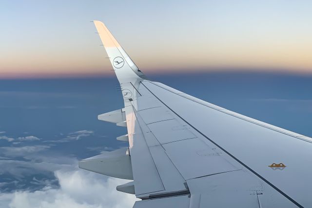 Airbus A321neo (D-AIEG) - Descending into EDDM from EFHK with a beautiful sunset glow illuminating the clouds.