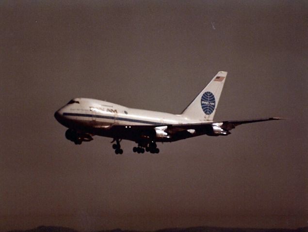 BOEING 747SP (N533PA) - Clipper New Horizons 747SP landing 28L/R at KSFO in this late 1970s photo- 1000mm Lens on 35mm print. Note the Commerative Flight 50 Logo on the fuselage.