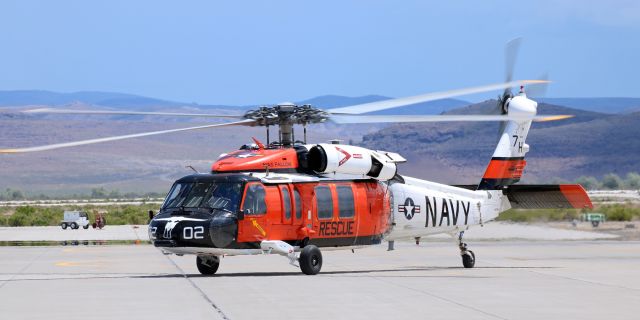 Sikorsky S-70 (16-5760) - A Sikorsky MH-60S Seahawk (165760) of the Navys SAR (Search and Rescue) Team at NAS Fallon prepares to lift off from the Hangar 7 ramp at KNFL. "Longhorn 02" was departing to conduct a water rescue training exercise at Lake Tahoe.