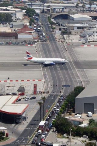 LGXB — - Gibraltar Airports runway has a major public road crossing it meaning every time a plane is due to land or take-off the road is closed much like a railway level crossing. The average time for an aircraft to land or depart is 10 minutes, so on busy days the road can be closed for over two hours.