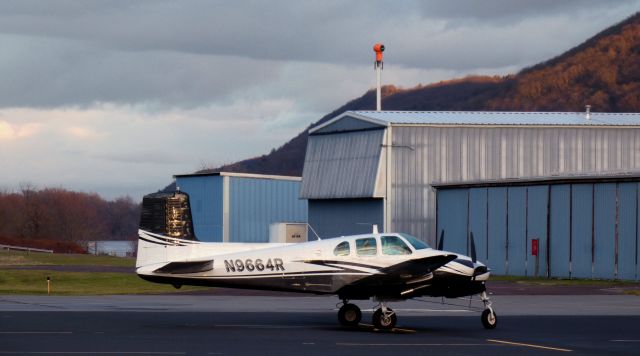 Beechcraft Twin Bonanza (N9664R) - Catching some tarmac time is this 1960 Beech D50C Twin Bonanza in late Winter of 2023.