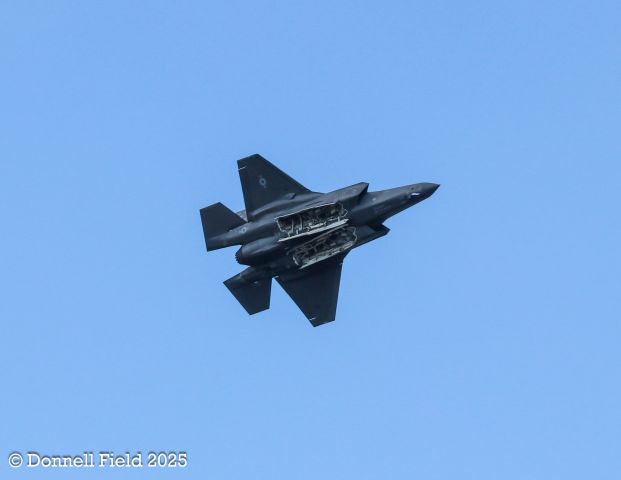 Lockheed F-35C — - F35 demo pilot performing banking maneuver with weapons doors open.