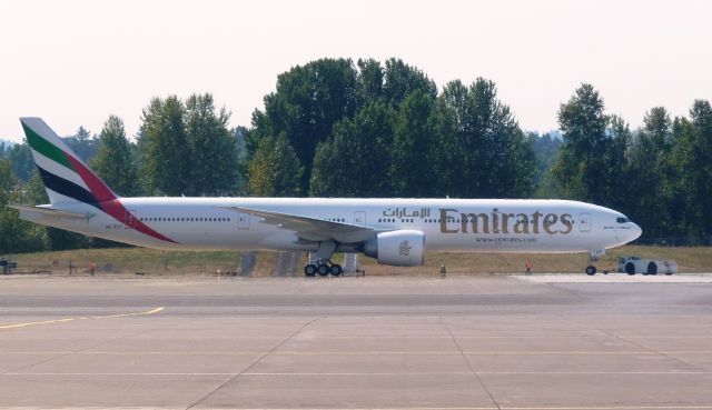 BOEING 777-300 (A6-EGF) - Fresh out of the Boeing paint hanger at PDX.