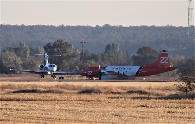 Hawker Beechcraft 4000 (N68HB) - RDD Oct 25 2020 Hawker Beechcraft 4000 landing in heavy cross wind on 34 as Airstrike Tanker 22 is waiting at the hold bars for take off for one of the many fires buring in Shasta County this day.