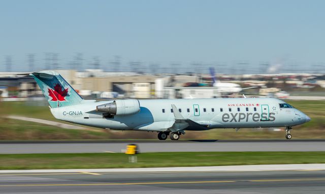 Canadair Regional Jet CRJ-200 (C-GNJA) - GGN7370 off to Washington Dulles. Panning shot at 1/60 second