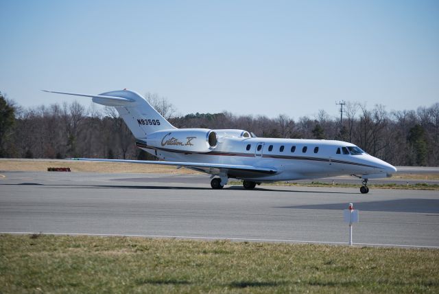 Cessna Citation X (N935QS) - Taxiing in from runway 02 at Concord Regional Airport - 2/23/09