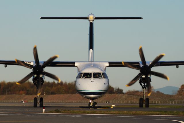 de Havilland Dash 8-400 (N416QX) - Head-on with a Horizon Air Q400 taxiing off of M3, onto M at Vancouver Intl Airport.