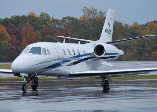 Cessna Citation Excel/XLS (N71LU) - FALWELL AVIATION / FAW71 (Liberty University) at KJQF with mascot logo of "Sparky the Eagle" on the tail - 11/6/14 