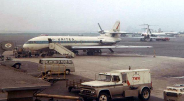 SUD-EST SE-210 Caravelle — - Another of my faded old Kodak 620 film photographs that I had tossed into the trash but then "rescued" (lol) from the garbage can just as the trash truck was approaching.  Not only was this mid-1960s snap of a UAL Sud Aviation Caravelle VI badly faded, but it was also taken rather far away with my old Kodak Bullseye camera so in the actual photo this Caravelle is really just a small part of the overall scene.  I cropped the shot down (which is why this gallery post is sized so small), and then I did my best to resurrect the color.  I considered turning it into just a B&W pic, but after examining both options I think that even tho it isnt great the color is OK so I posted this one.br /The photo was taken at Newark Metropolitan Airport (known today as Newark Liberty International - KEWR).  