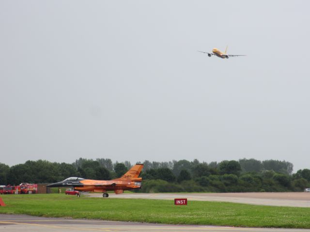 Lockheed F-16 Fighting Falcon (J015) - Dutch F-16 exiting runway after demonstration. B757 DHL in approach for staring its demonstration at RIAT 2012.