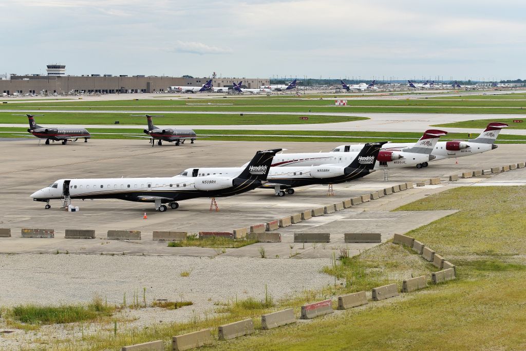 Embraer ERJ-145 (N508RH) - Three racing teams aircraft on the Signature overflow ramp 08-13-23. Hendricks Racking: N509RH - N508RH - Joe Gibb's Racing: N520JG - N519JG - Dale Earnhardt/Champion Air: N3DE - N138DE. 08-13-23. Getting ready to depart after the Brickyard Race was over.