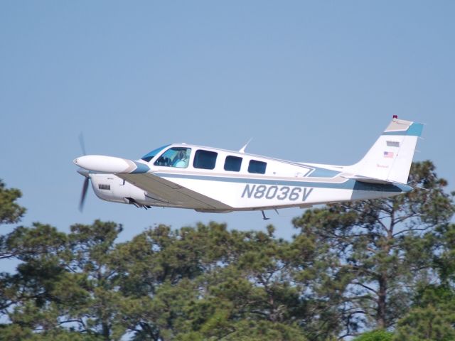 Beechcraft Bonanza (36) (N8036V) - Departing runway 21 - 4/24/09