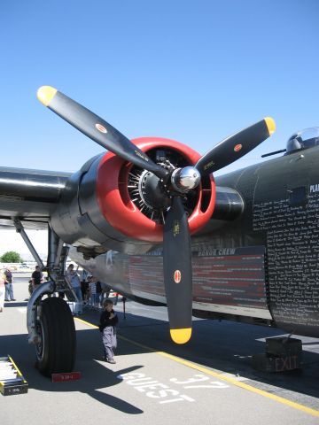 Consolidated B-24 Liberator (N224J) - No. 3 engine and right main gear of the Collings B-24 at Livermore, California, May 2006.  Nose the comparative scale of size between the boy and the main gear.