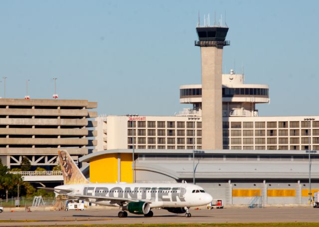 Airbus A319 (N906FR) - I love that the tower sits in front of the Marriott at Tampa International