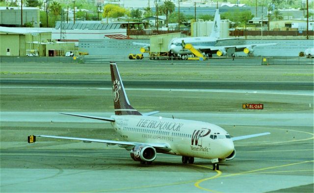 BOEING 737-300 (N947WP) - KPHX - The Flying Billboard Airline  Western Pacific based out of Colorado Springs CO USA was quite the innovative Airline. We used to see these at San Jose, CA USA several times a day and I got all but 2 of the logojets on film. This was LN 1308 and delv new to US Air as N370AU in Nov 1986.