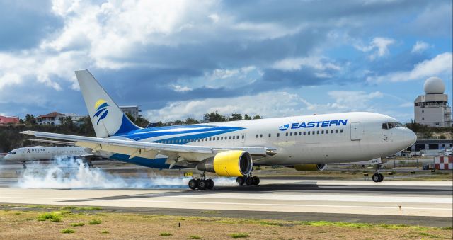 BOEING 767-200 (N602KW) - Eastern Airlines boeing 767-200 flying for sunwing airlines seen making positive contact with her main landing gears at TNCM St Maarten 09/05/2019