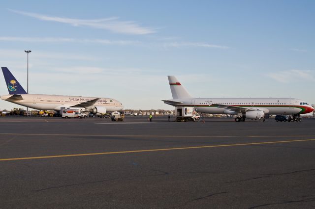 Boeing 777-200 (HZ-AKF) - HZ-AKF B777 and A4O-AA A320 parked in North Cargo hard stands 