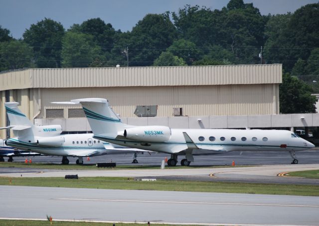 Gulfstream Aerospace Gulfstream V (N653MK) - MERCK SHARP & DOHME CORP parked at Signature Aviation. Also on the ramp are two of their F900s (N501MK-pictured and N663MK-not pictured)  - 5/14/12