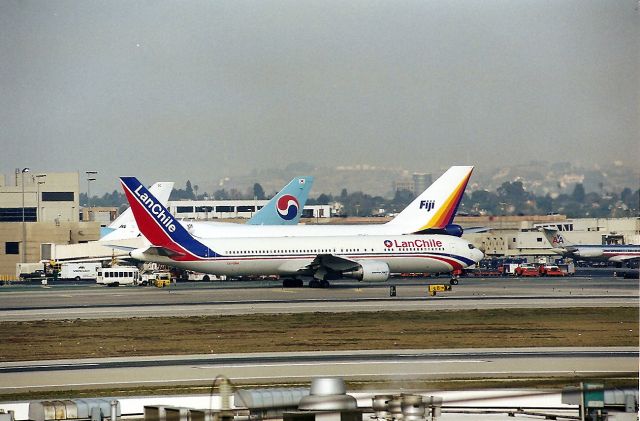 BOEING 767-300 (CC-CRM) - KLAX - before the name change - LAN Chile had an awesome paint scheme on their globetrotting 767 s - I also got video of this landing 25 L - posted on my jetvideos.net page. This photo from Imperial Hill - Jan 1998.