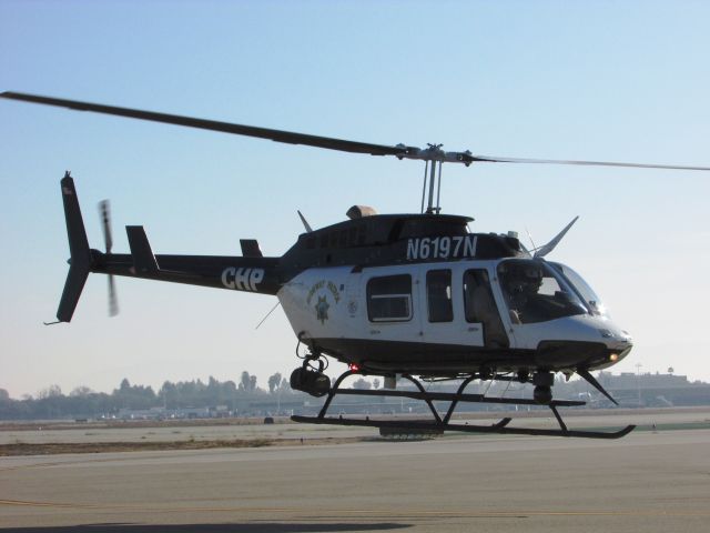 Bell JetRanger (N6197N) - Hovering to display area