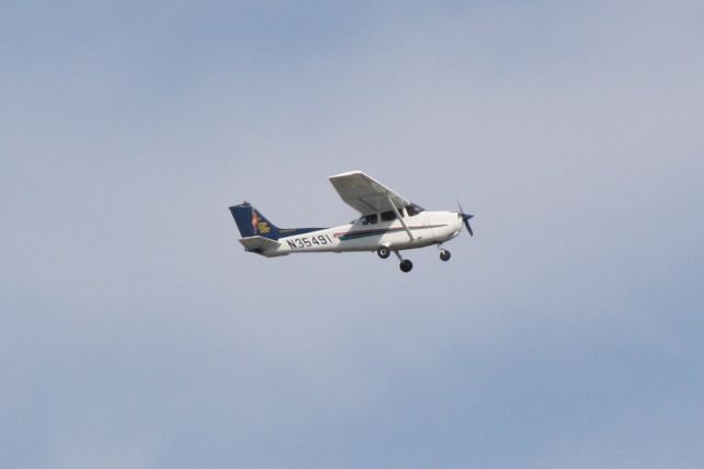 Cessna Skyhawk (N35491) - Cessna Skyhawk (N35491) flies over Sarasota-Bradenton International Airport