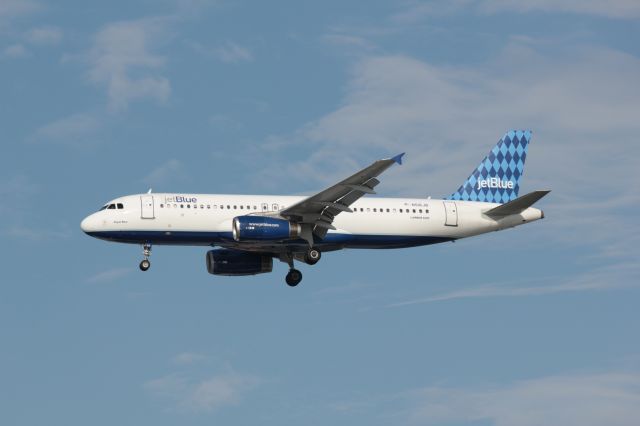 Airbus A320 (N516JB) - JetBlue, N516JB, Airbus A320 on final approach into Tampa, Florida.  Photo by John A. Miller, Photo Enrichments