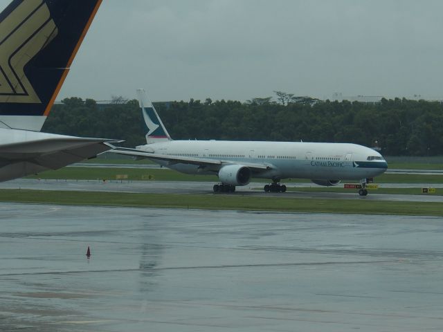 BOEING 777-300 (B-HNF) - Backtracking to stand taken from departure lounge.