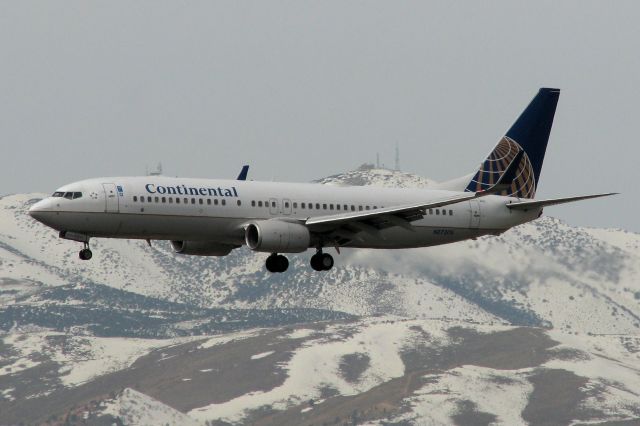 Boeing 737-800 (N27205) - This first photo of N27205 in the FA photo gallery shows it still wearing the COA name. Under hazy overcast skies and with Peavine Mountain in the background, N27205 approaches RTIAs runway 16R at the completion of a flight from Houston (KIAH).