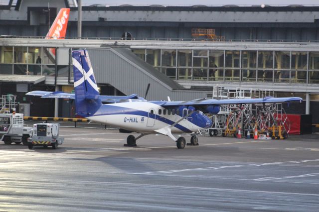 De Havilland Canada Twin Otter (G-HIAL) - A Loganair Viking DHC-6-400 Twin Otter parked at a stand at Glasgow Airport.br /br /Locaton: Glasgow Airport.br /Date: 25.11.22 (dd/mm/yy).