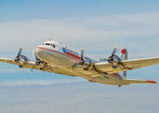 Douglas C-54 Skymaster (N96358) - This DC4 is continuing life as a real life bush plane in Alaska. Seen here departing out of Kenai, she was headed to a remote village called Kokhanok with a load of fuel for the residents. ©Bo Ryan Photography | a rel=nofollow href=http://www.facebook.com/BoRyanPhotowww.facebook.com/BoRyanPhoto/a Please vote if you like the image!