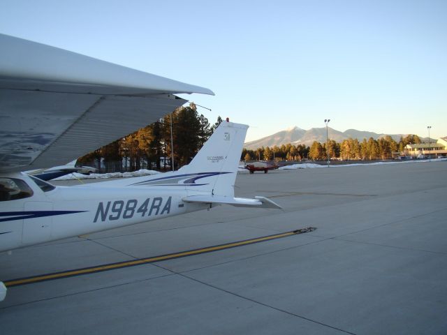 Cessna Skyhawk (N984RA) - Parked @ Wiseman Aviation in Flagstaff. The San Francisco peaks can be seen in the background.