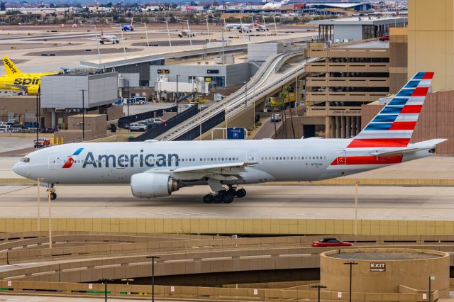 Boeing 777-200 (N756AM) - An American Airlines 777-200 taxiing at PHX on 2/14/23. Taken with a Canon R7 and Canon EF 100-400 II L lens.