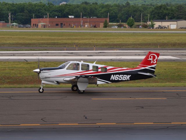 Beechcraft Bonanza (36) (N65BK) - Taxiing out for departure at KBAF on 6/22/2018 . Sharp Beechcraft colors on this little guy. 