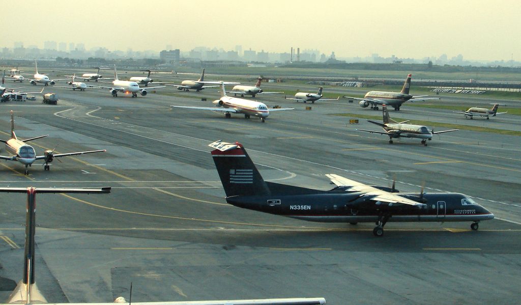 de Havilland Dash 8-300 (N335EN) - Piedmont Dash 8-300 N335EN is ready to taxi at Spot 22 on a typical busy dusk at KLGA on May 31, 2007 !