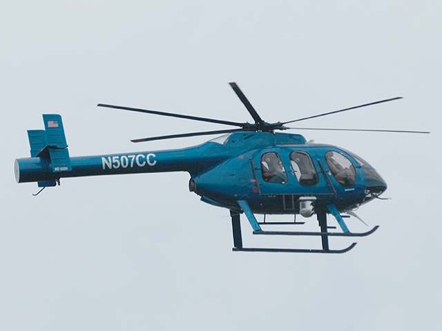 MD HELICOPTERS MD-600N (N507CC) - The crew of this MD600N inspects high tension power lines near Hurlburt Field (Ft. Walton Beach), Fla. The 600N is an eight-place, light, single-turbine engine helicopter with an advanced NOTAR anti-torque system. (an f-stop 5.6 photograph)