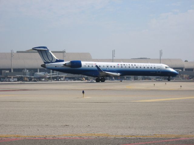 Canadair Regional Jet CRJ-700 (N748SK) - Holding on RWY 19R