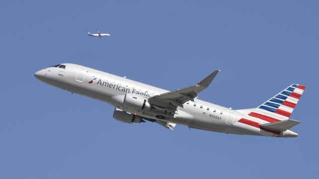 Embraer 175 (N505SY) - Departing LAX on 25R with an Alaska Airlines 737 on the downwind for 24R in the background
