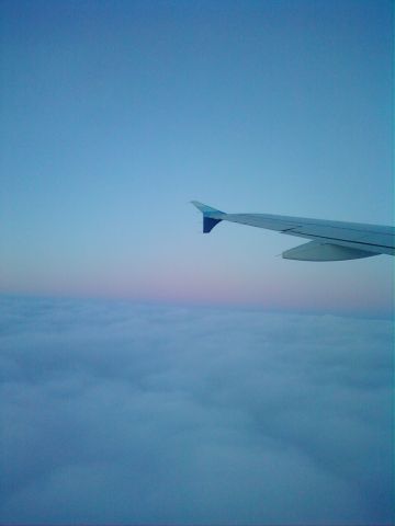 — — - Popping out of the clouds after leaving KCVG